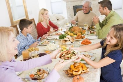 Family around a table at Christmas